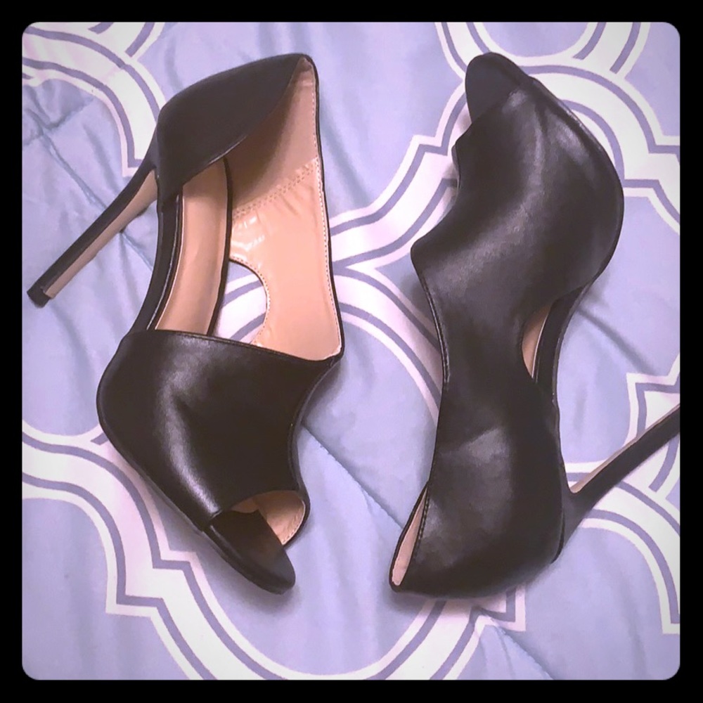 New,black leather heels,never been worn.